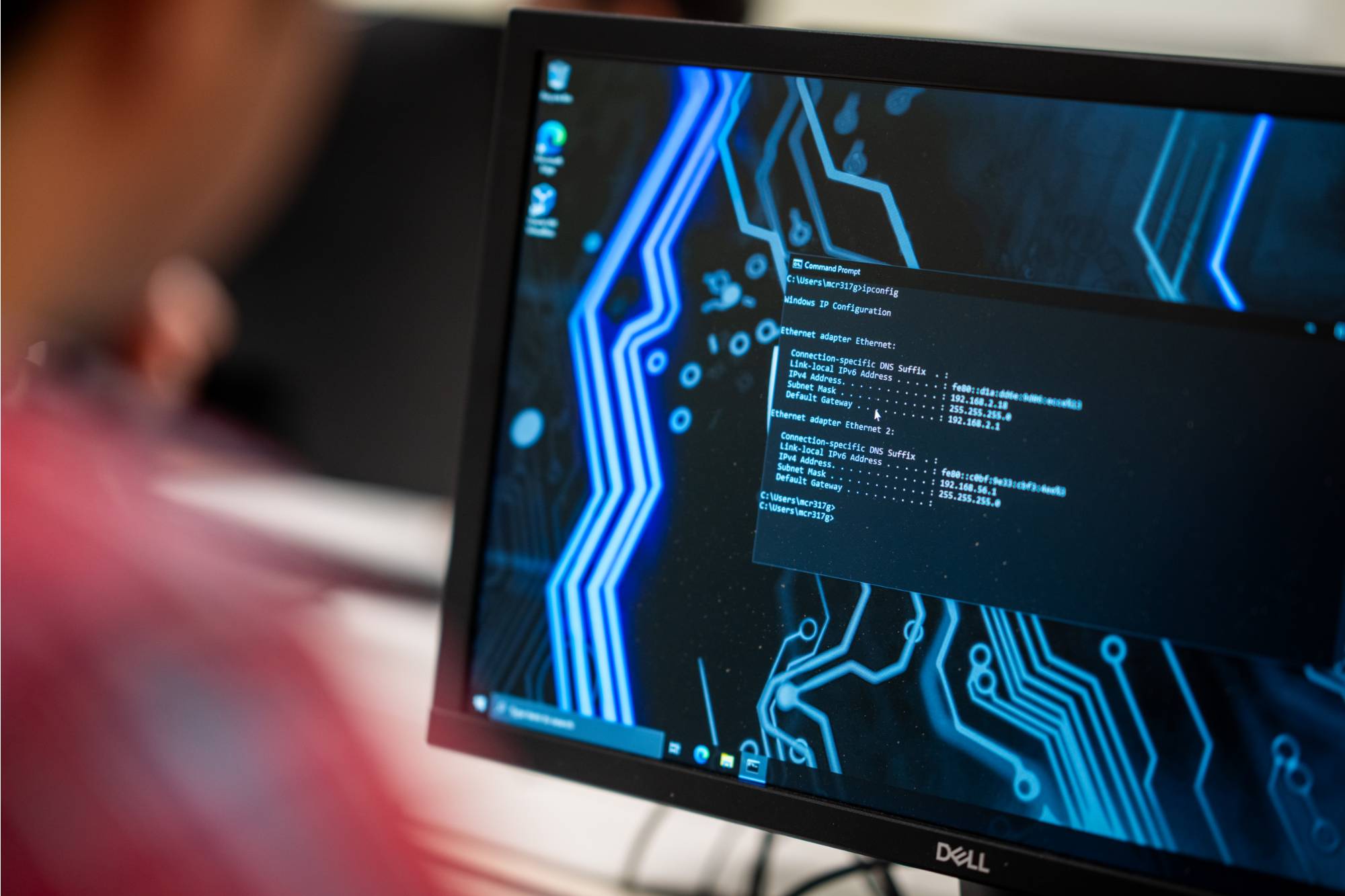 Students working together on a hands-on computing project in a lab setting, with a caption describing Grand Valley State University's School of Computing offering knowledge and real-world experience to undergraduates in a tech-driven world, fostering innovation, creativity, and leadership.